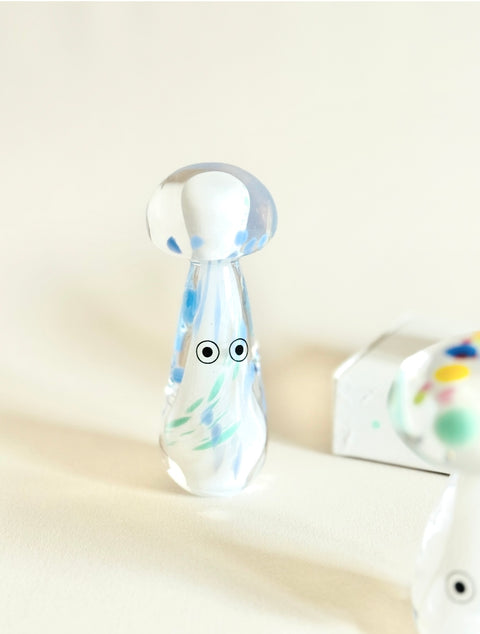 Studio Arhoj Crystal Blobs Clear glass mushroom figurine with colorful design on a light background